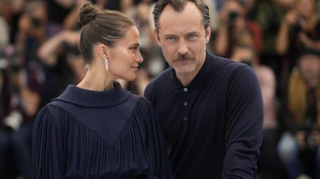 Alicia Vikander, left, and Jude Law pose for photographers at the photo call for the film 'Firebrand' at the 76th international film festival, Cannes, southern France, Monday, May 22, 2023. 