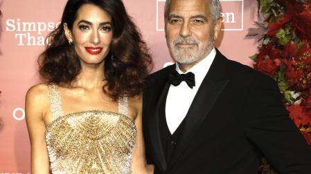 US actor George Clooney (R) and wife human rights attorney Amal Clooney attend the Albie Awards