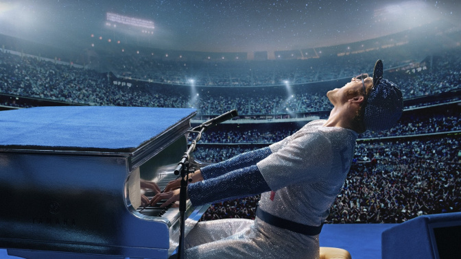 This image released by Paramount Pictures shows Taron Egerton as Elton John in a scene from "Rocketman." The film was nominated for a Golden Globe for best motion picture comedy. (David Appleby/ Paramount Pictures via AP)